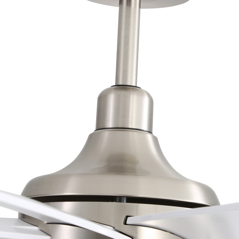 Close-up of brushed nickel ceiling fan downrod and motor housing with white blades