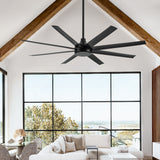 AeroSpan 65-inch black 8-blade ceiling fan installed on a vaulted ceiling with exposed wood beams