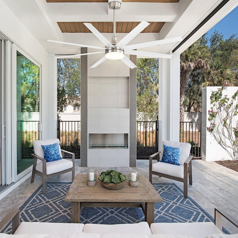 White 8-blade ceiling fan with integrated LED light installed on a covered outdoor patio