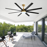 Black and gold AeroSpan Lux ceiling fan with LED light installed on a spacious covered outdoor patio