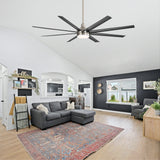 Black 8-blade ceiling fan with LED light and brushed silver finish installed in a vaulted living room