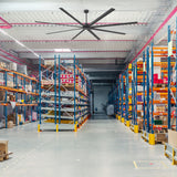 AirForge 120-inch HVLS industrial ceiling fan installed above warehouse storage racks