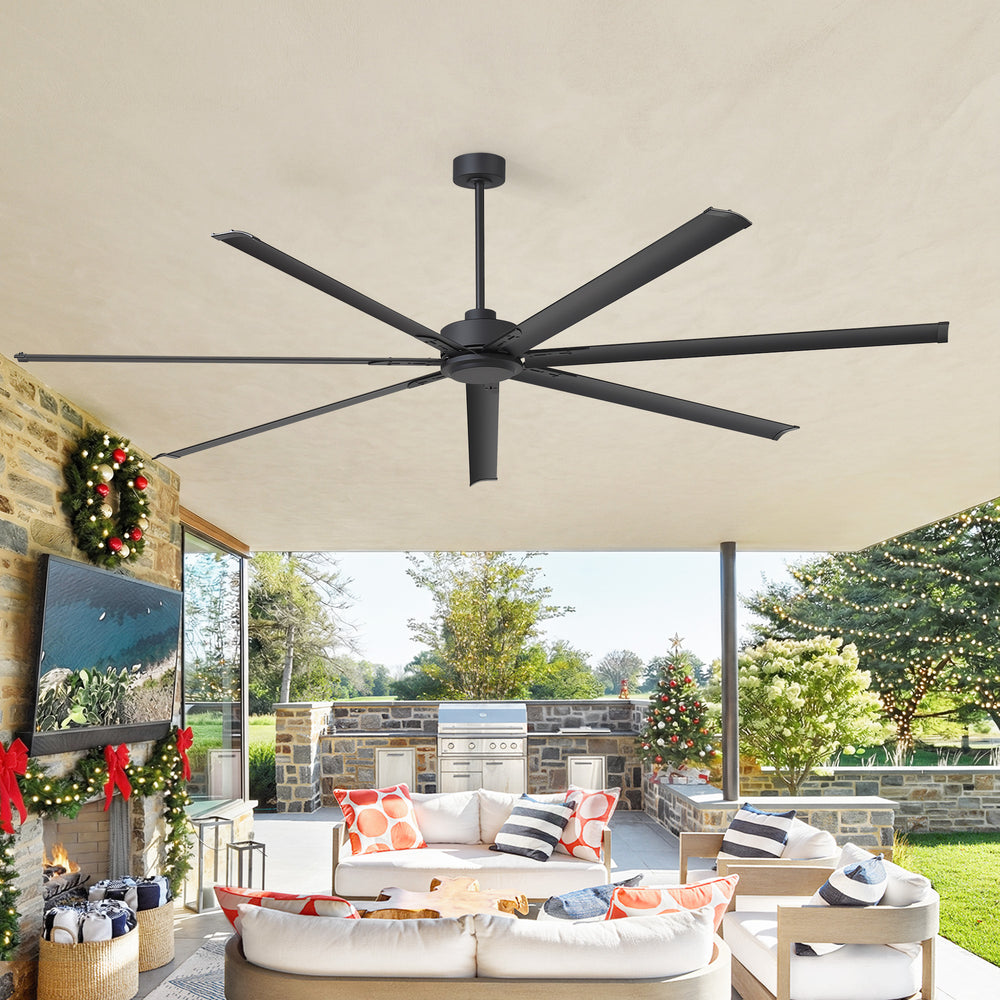 Ceiling fan in a room with outdoor view and festive decorations