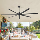 Ceiling fan in a room with outdoor view and festive decorations