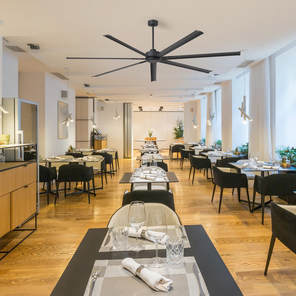 96-inch large black ceiling fan installed in a spacious modern restaurant dining area
