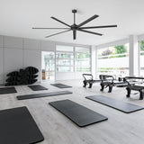 96-inch large black ceiling fan installed in a spacious modern fitness studio