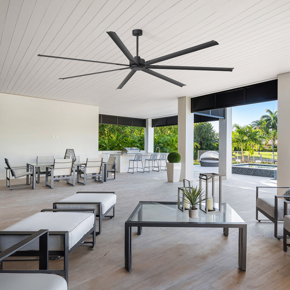 AeroSpan XL large black ceiling fan installed on a spacious covered patio for comfortable outdoor air circulation