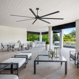AeroSpan XL large black ceiling fan installed on a spacious covered patio for comfortable outdoor air circulation
