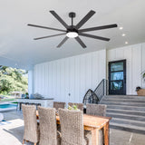 Living room dark wood beams and leather sectional under Luminor 72-inch black 8-blade ceiling fan