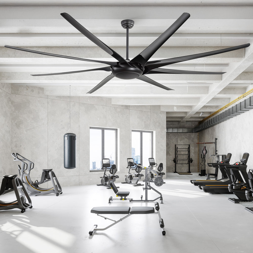 AeroSpan-XL 84/100-inch large black ceiling fan installed in a spacious gym