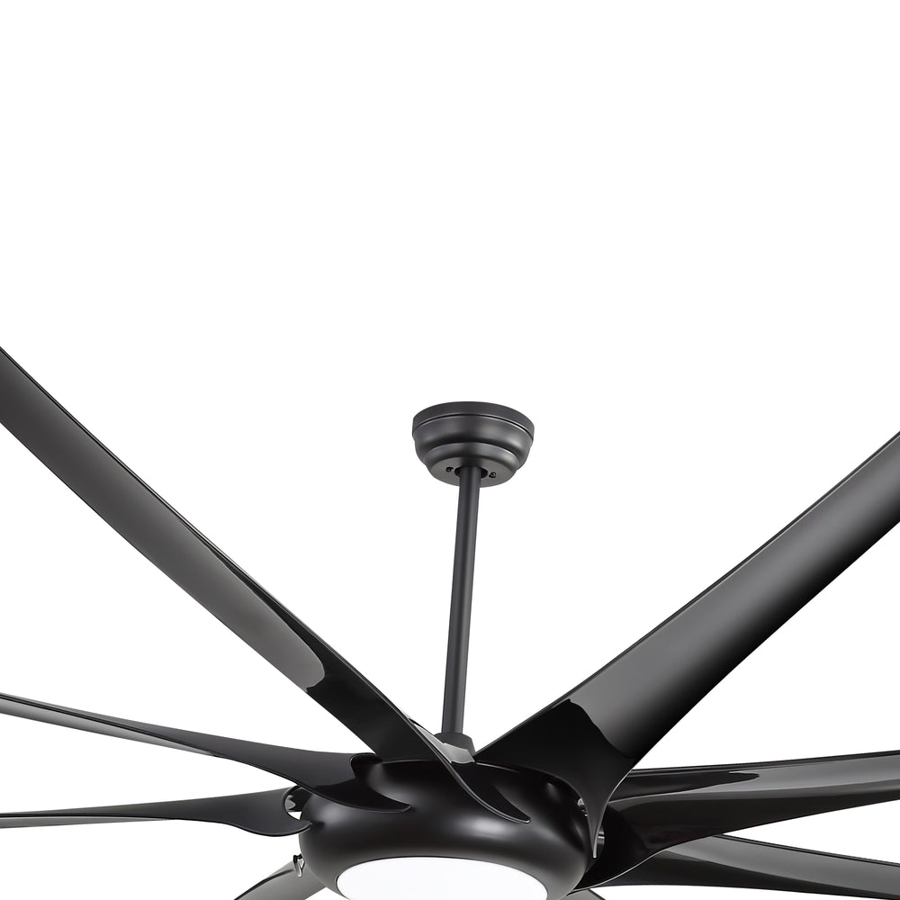 Close-up of a large black ceiling fan with downrod, multi-blade design and integrated LED light
