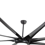 Close-up of a large black ceiling fan with downrod, multi-blade design and integrated LED light