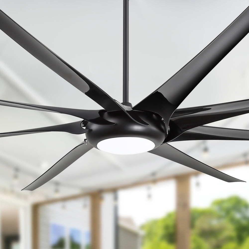 Close-up of AeroSpan-XL large black ceiling fan with integrated LED light turned on