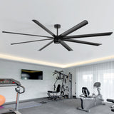 100-inch black AeroSpan XL ceiling fan with remote installed in a modern home gym