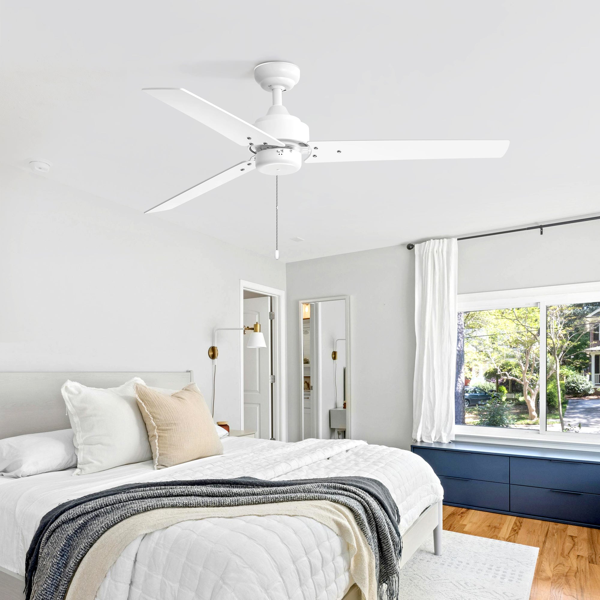 Vesora white ceiling fan with no light installed in a bedroom