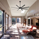 AeroSpan Lux 72-inch large black 8-blade ceiling fan with LED light installed in a spacious covered sunroom