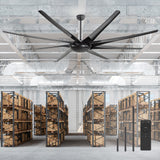 AeroSpan-XL 84/100-inch large black ceiling fan with remote installed in a warehouse