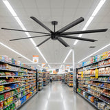 100-inch black AeroSpan XL large ceiling fan installed above a spacious supermarket aisle
