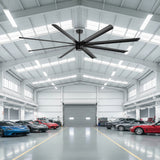 100-inch black AeroSpan XL large ceiling fan installed in a spacious automotive garag