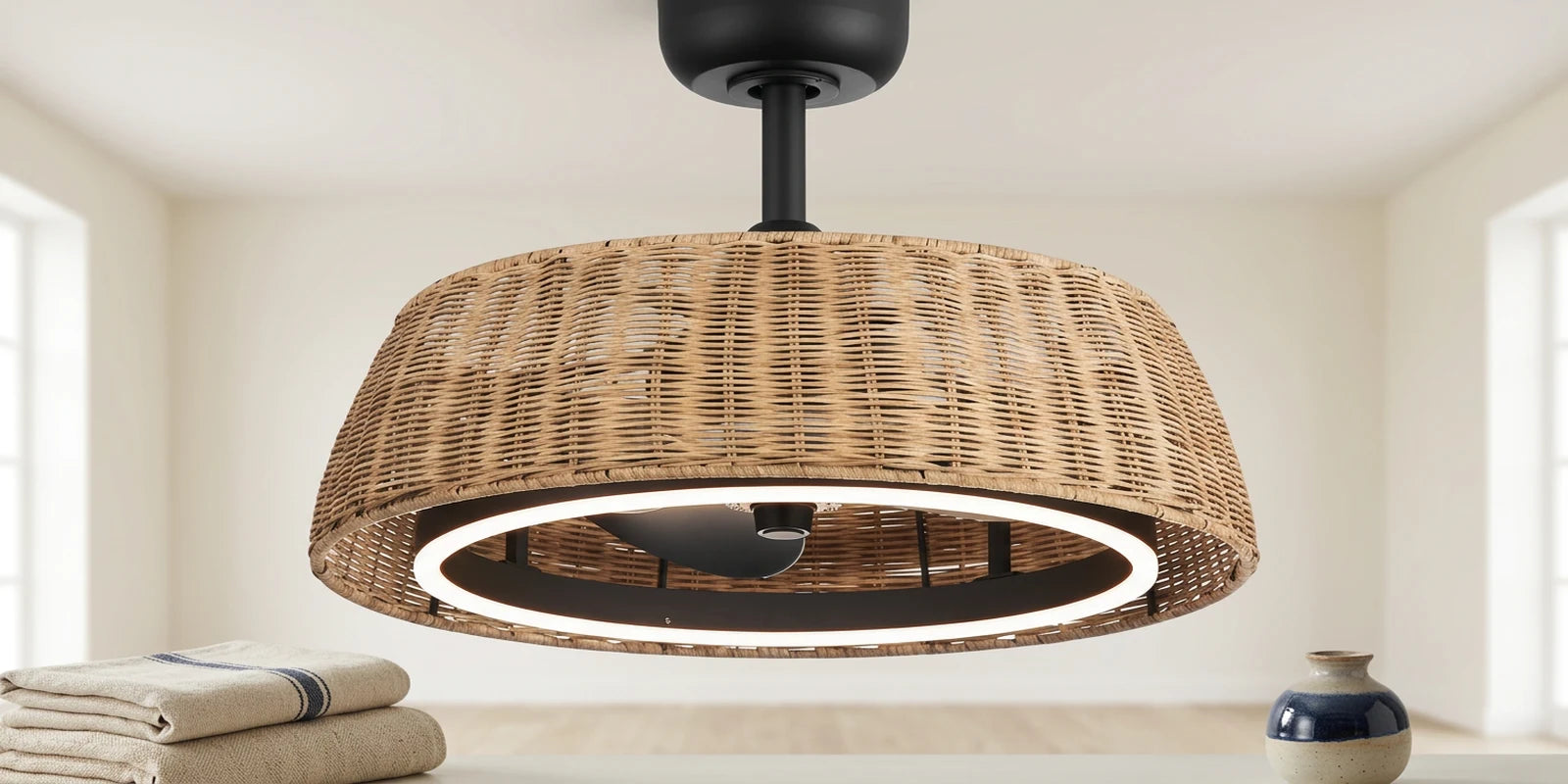 Close view of a woven boho fandelier ceiling fan with natural texture, black hardware and circular light