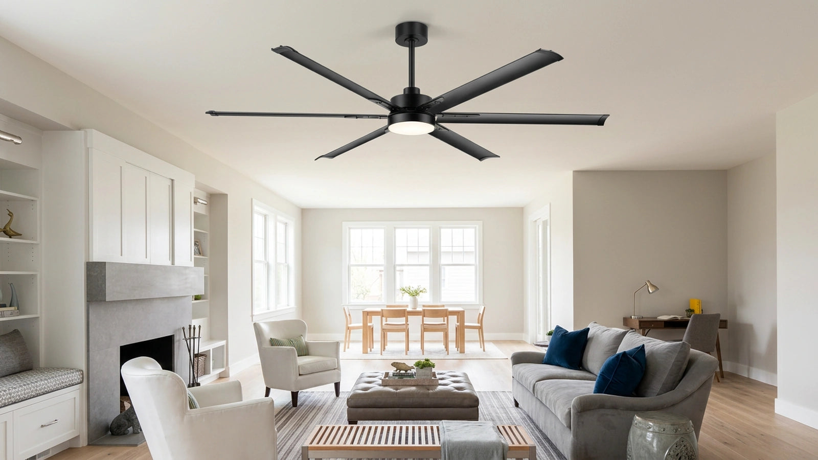 large aluminum blade ceiling fan with light installed in a spacious residential living room