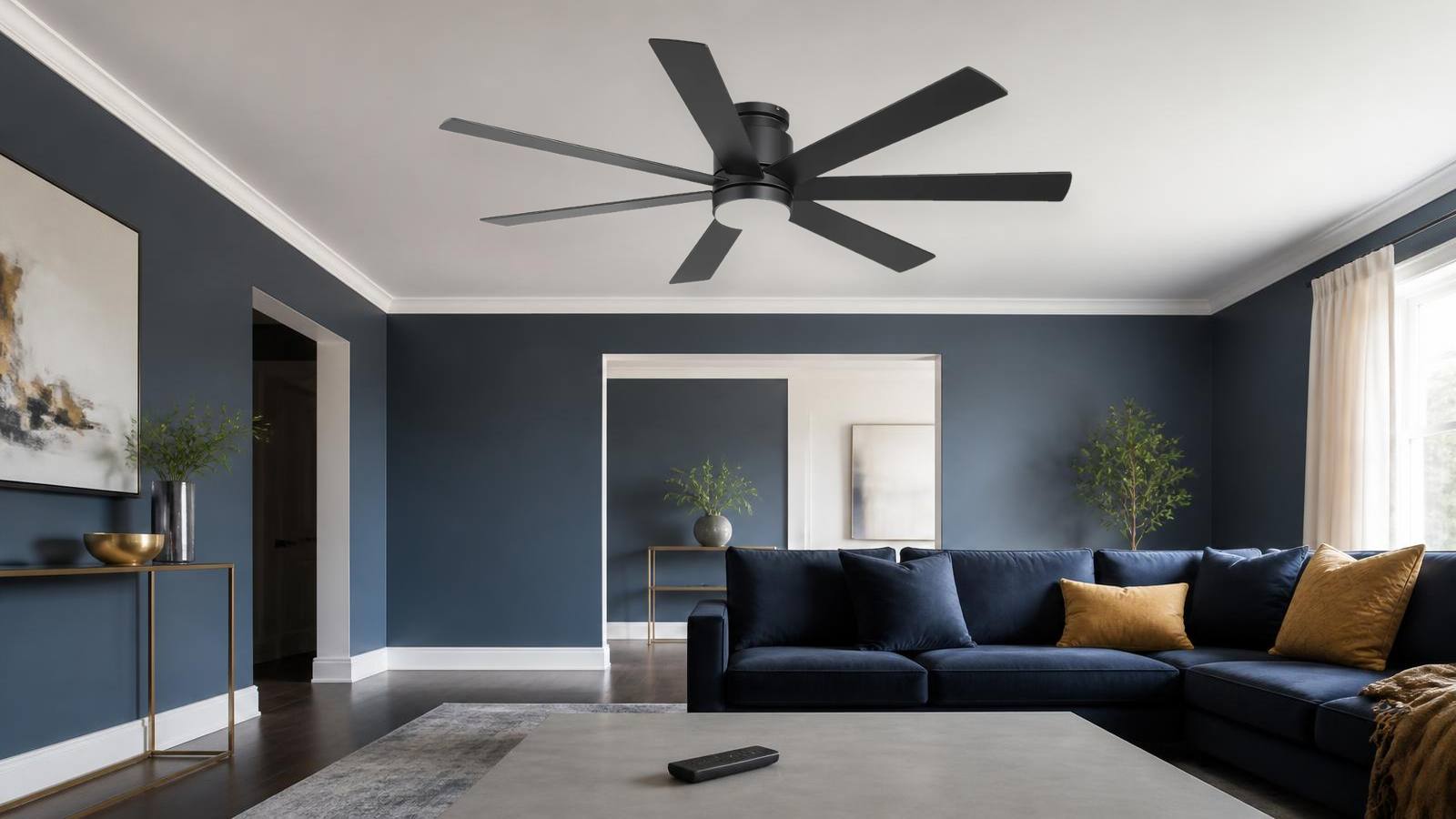 Large flush mount ceiling fan with handheld remote control in a modern indoor room