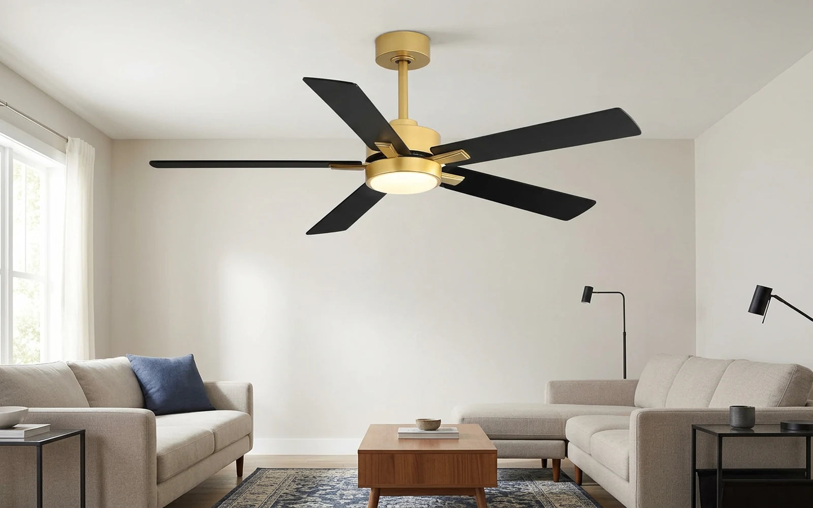 52 inch black and gold ceiling fan with integrated LED light installed in a modern living room