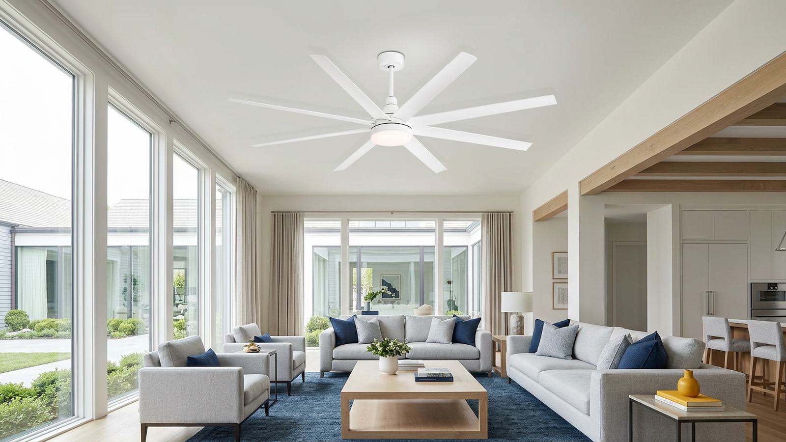 Large white ceiling fan installed in a high-ceiling indoor room