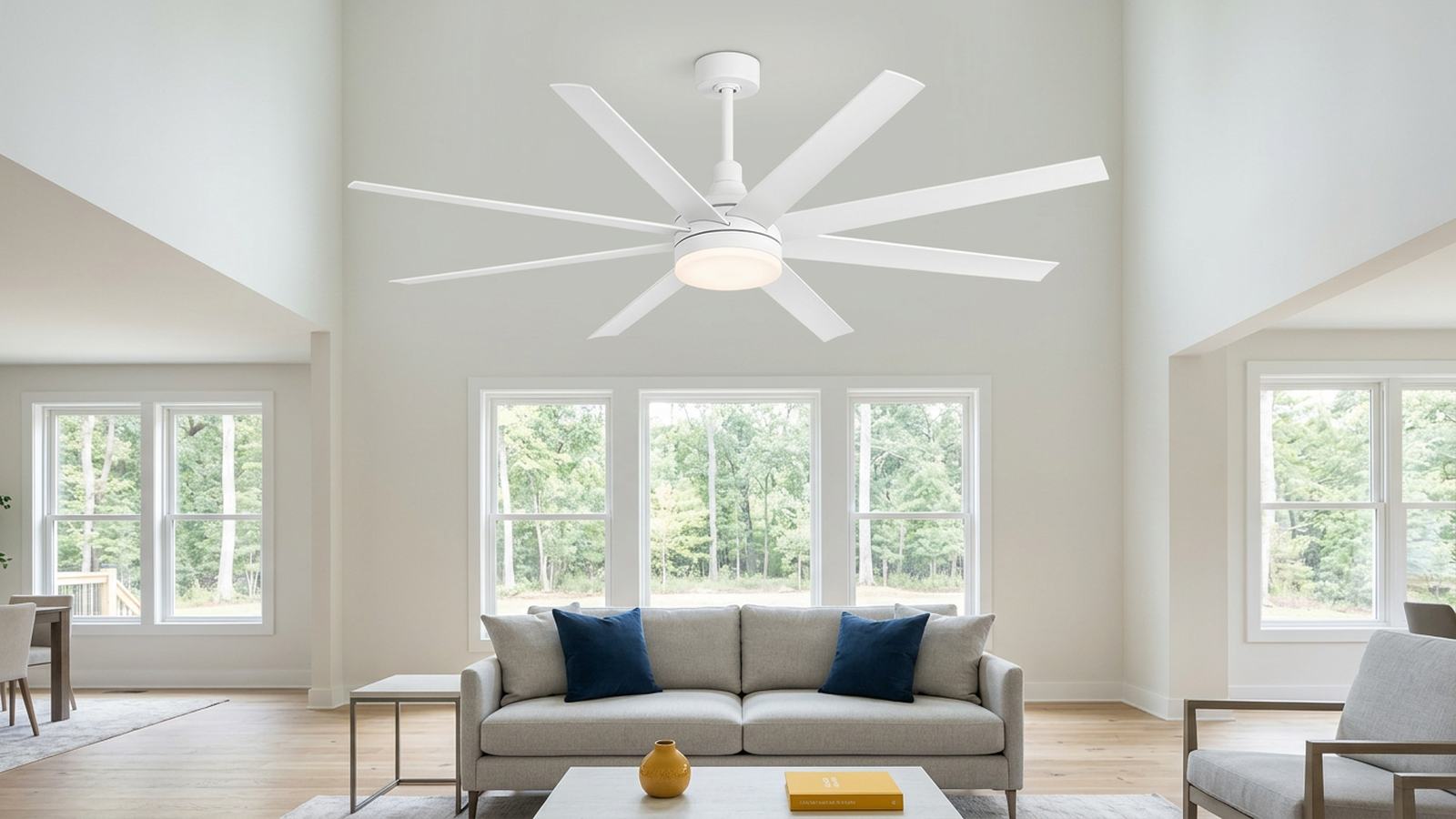 Large white ceiling fan with integrated LED light in a bright indoor room