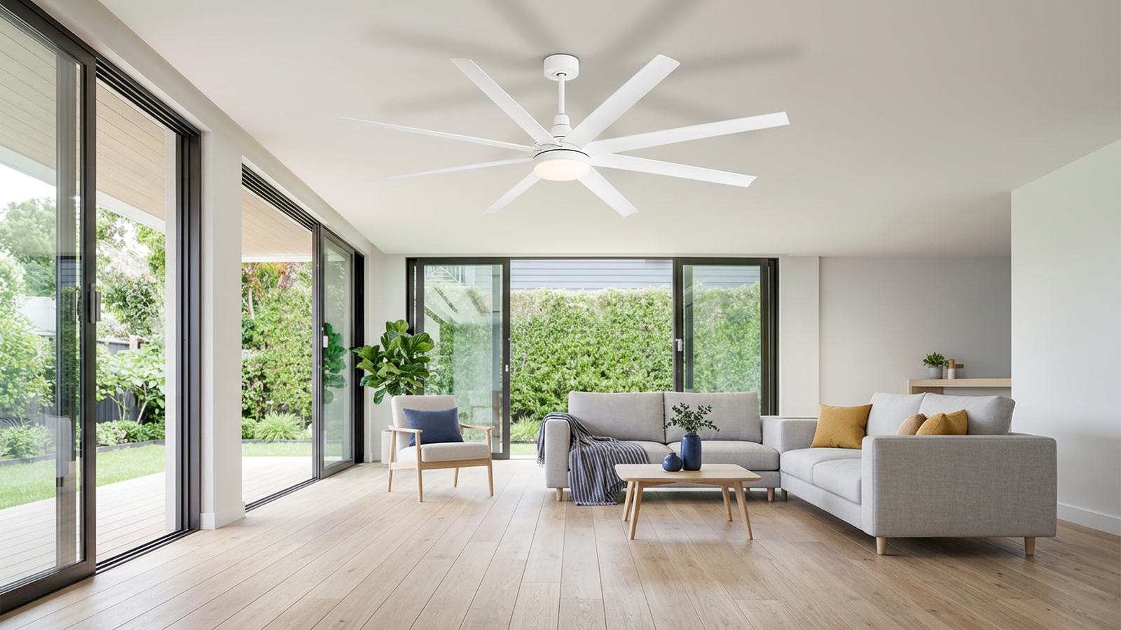 Large white ceiling fan installed in a bright living room