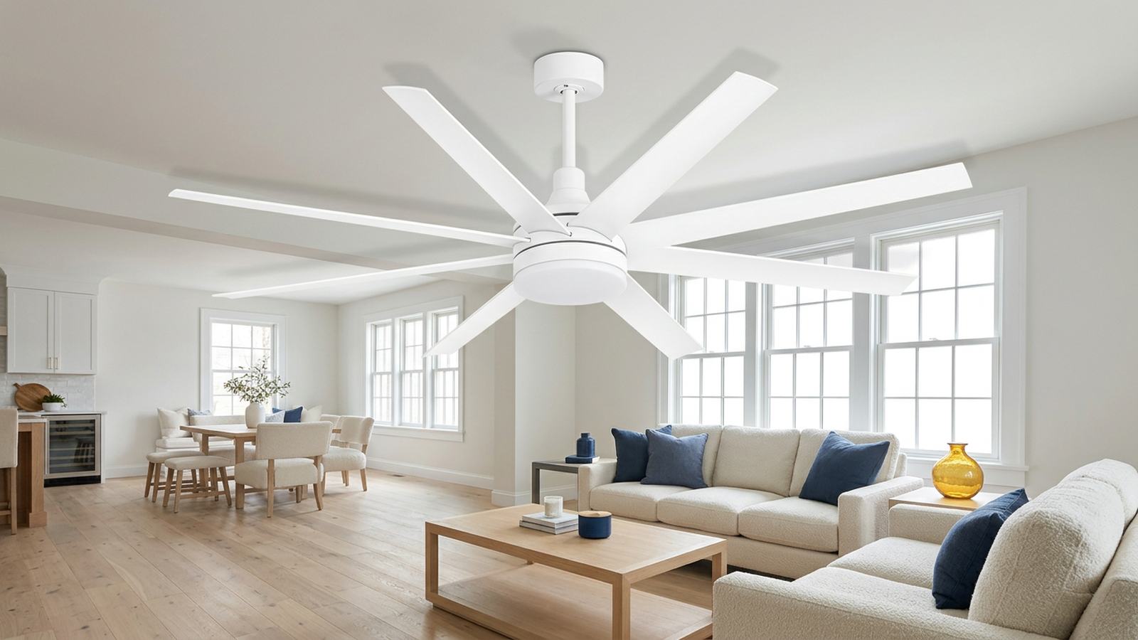 Modern white ceiling fan in a bright interior with natural wood furniture