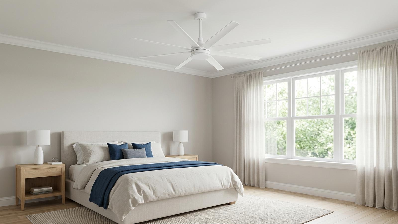 White ceiling fan with light in a spacious bedroom